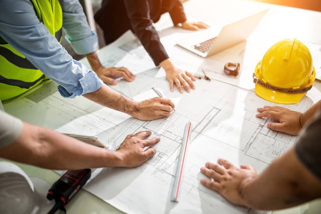team of engineers drawing planning infrastructure