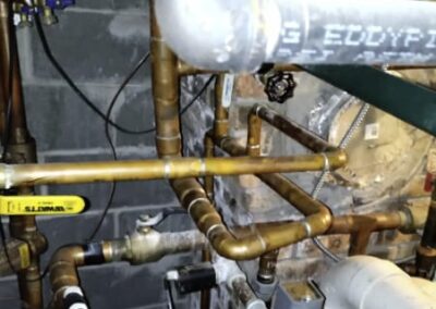 Replace & Reconfigured pipes, new circulating pump, zones valves, spiral vent air removing system for hot water baseboard heating